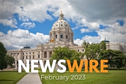 [ai] The Minnesota State Capitol building viewed from a park, featuring its dome and exterior architecture under a partly cloudy sky. The text 'NEWSWIRE February 2023' is overlaid at the bottom.